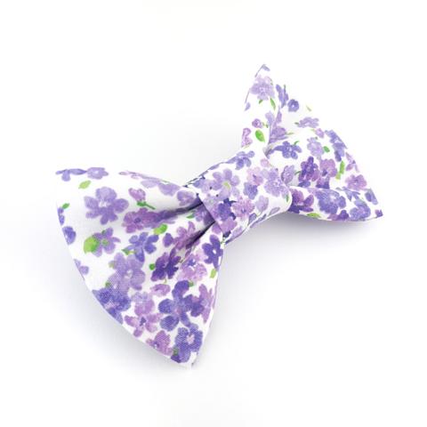 Purple and white floral dog bow tie featuring purple flowers