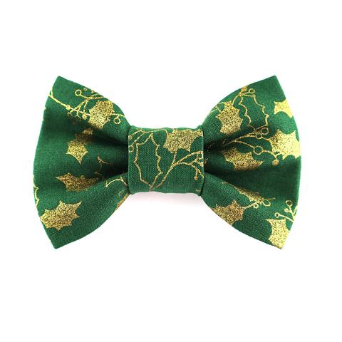 green christmas dog bow tie with gold holly leaves on a white background